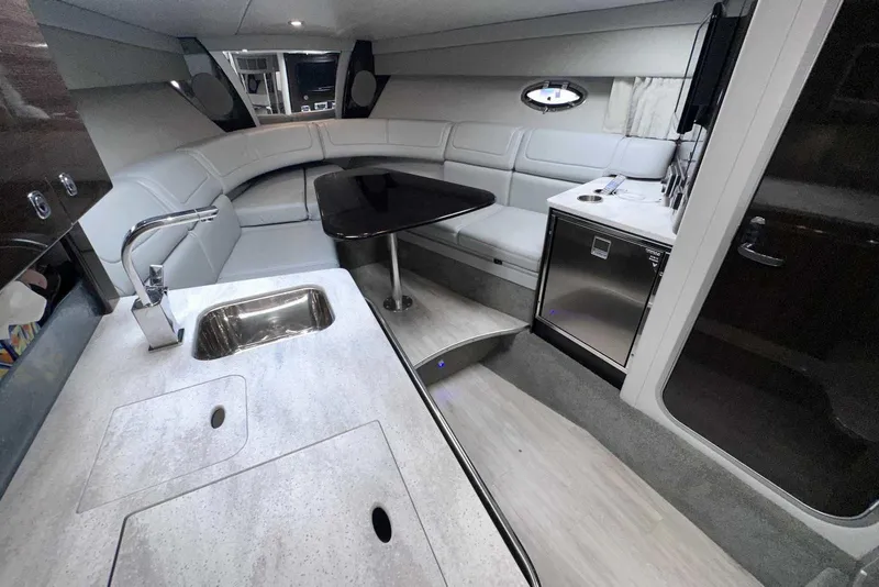 Slide: The Image of 2018 Formula 350 Sun Sport interior with kitchenette, seating, and modern amenities. - 32