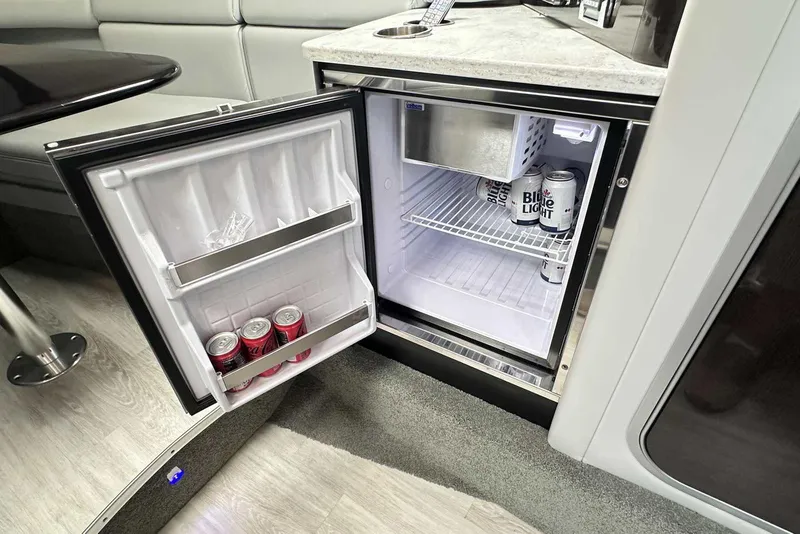 Slide: The Image of Mini fridge inside 2018 Formula 350 Sun Sport boat, stocked with beverages. - 35