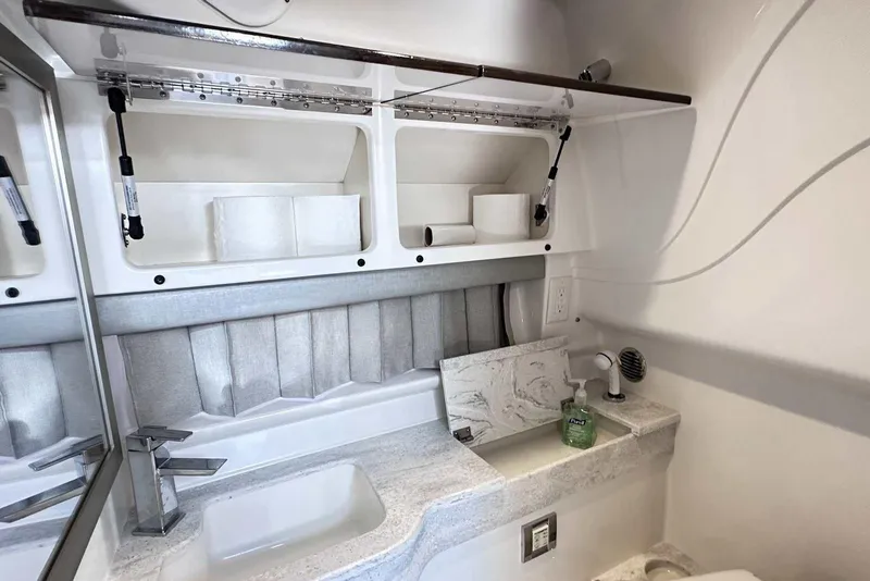 Slide: The Image of 2018 Formula 350 Sun Sport bathroom with modern sink, storage shelves, and soap dispenser. - 42