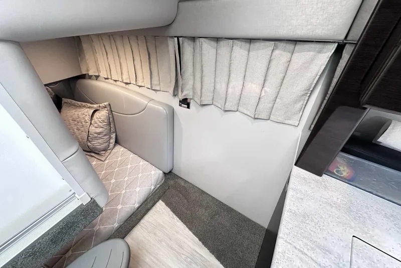 Slide: The Image of 2018 Formula 350 Sun Sport cabin interior with cushioned seating and elegant curtains. - 43