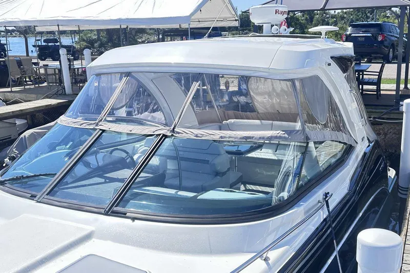 Slide: The Image of 2018 Formula 350 Sun Sport boat docked, featuring sleek design and spacious cockpit. - 5