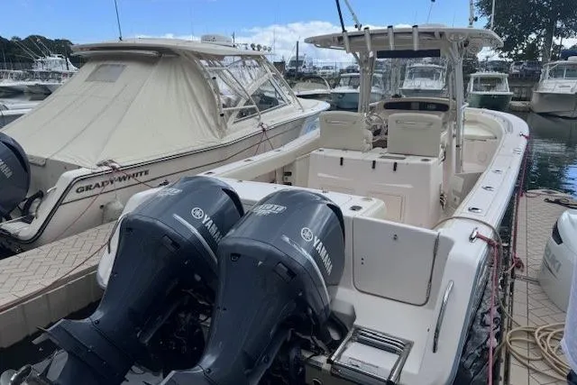 The Image of 2011 Grady-White Canyon 306 boat docked with twin Yamaha engines. - 0