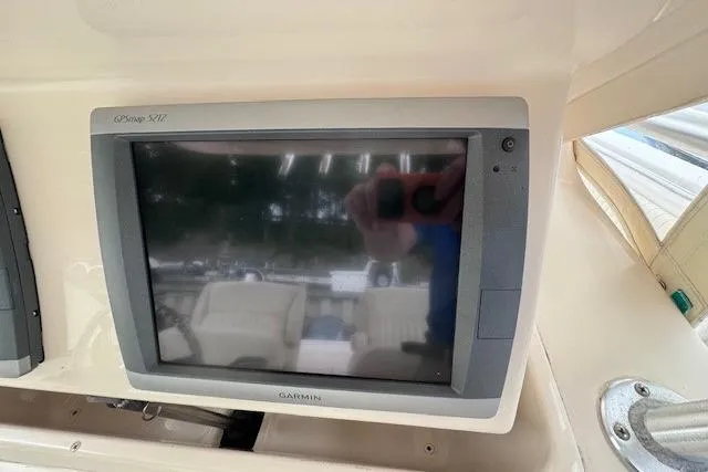 Slide: The Image of Garmin GPSmap 5212 display on 2011 Grady-White Canyon 306 boat dashboard. - 15