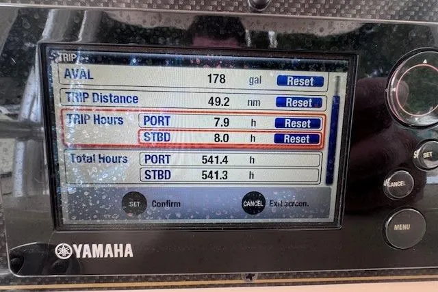 Slide: The Image of Yamaha display on 2011 Grady-White Canyon 306 showing trip and total hours. - 19