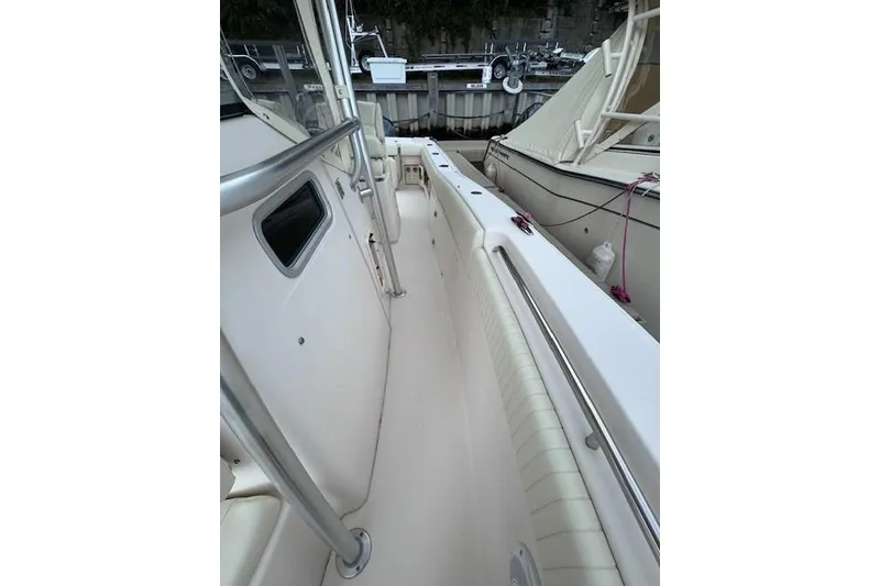 Slide: The Image of 2011 Grady-White Canyon 306 boat interior with sleek design and stainless steel railings. - 20