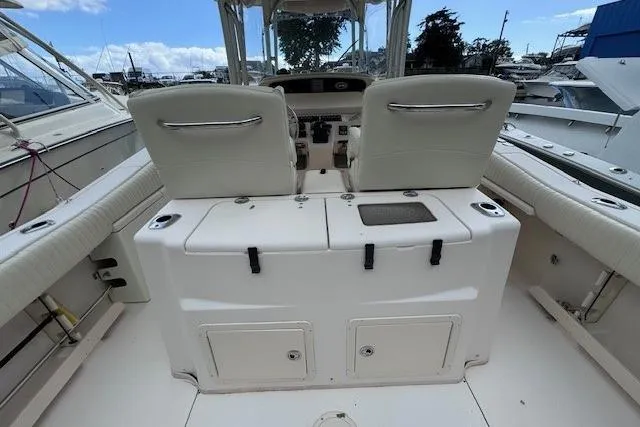 Slide: The Image of 2011 Grady-White Canyon 306 boat interior with dual seats and control panel. - 6