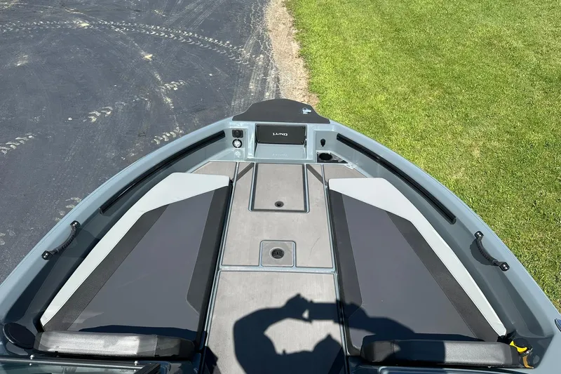 Slide: The Image of 2026 Lund 185 Impact GL boat interior with seating and storage compartments. - 14