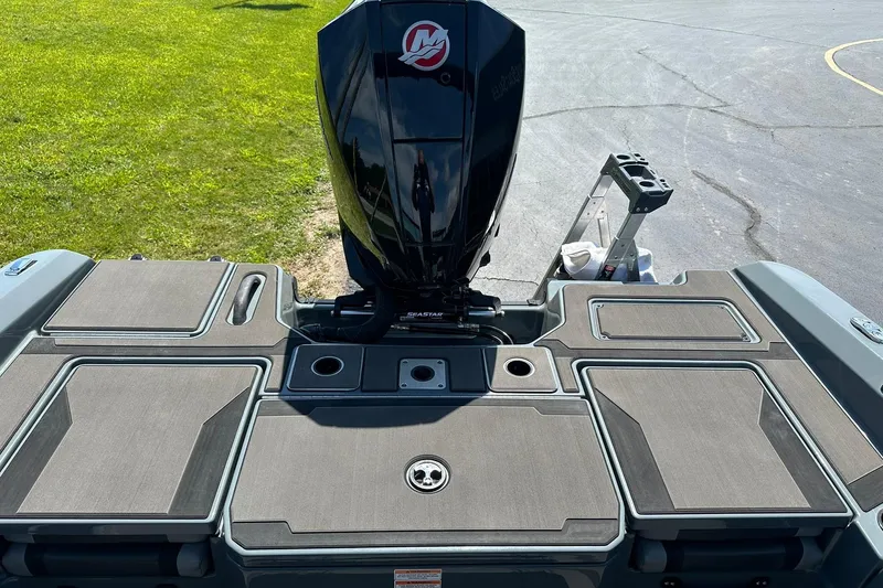 Slide: The Image of 2026 Lund 185 Impact GL boat with sleek deck and powerful outboard motor. - 16