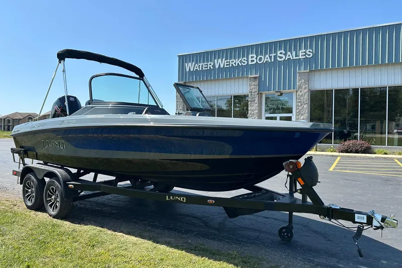 Slide: The Image of 2026 Lund 185 Impact GL boat on trailer at Water Werks Boat Sales. - 2