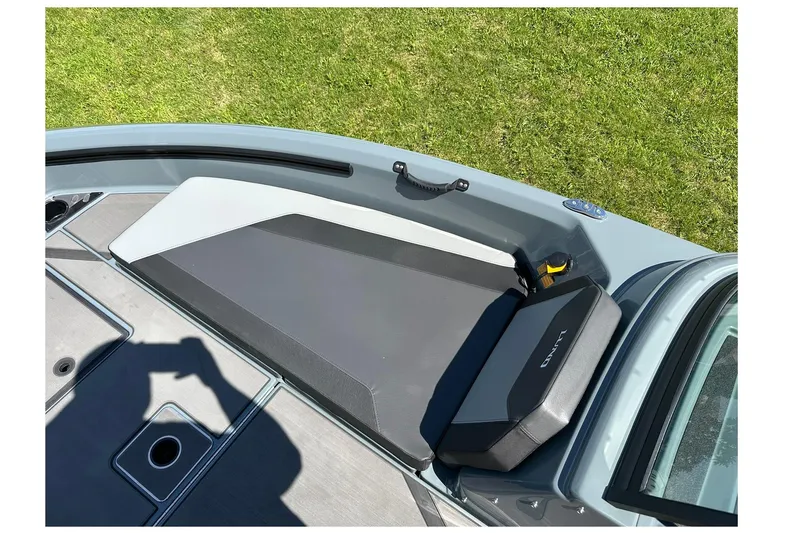 Slide: The Image of 2026 Lund 185 Impact GL boat interior with cushioned seating and storage compartments. - 25