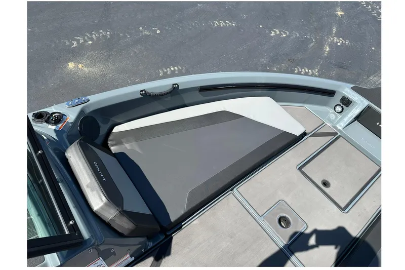 Slide: The Image of 2026 Lund 185 Impact GL boat interior with sleek seating and storage compartments. - 26