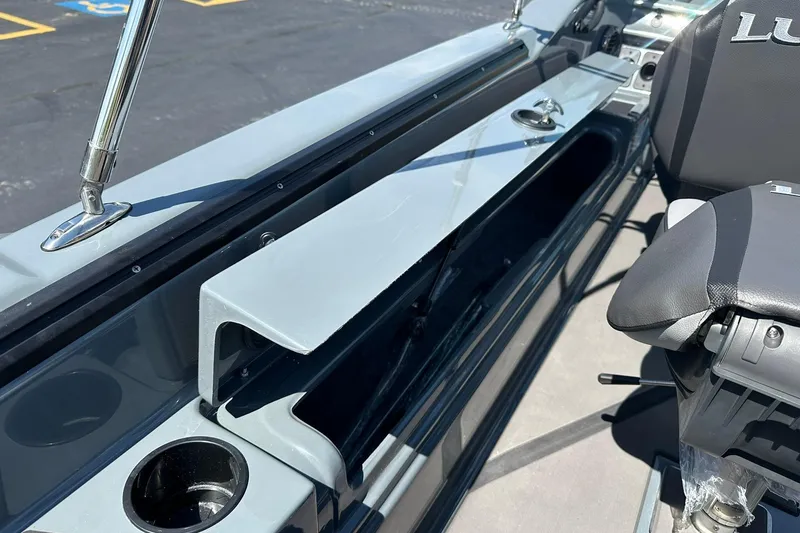 Slide: The Image of 2026 Lund 185 Impact GL boat interior with storage compartment and seating. - 34
