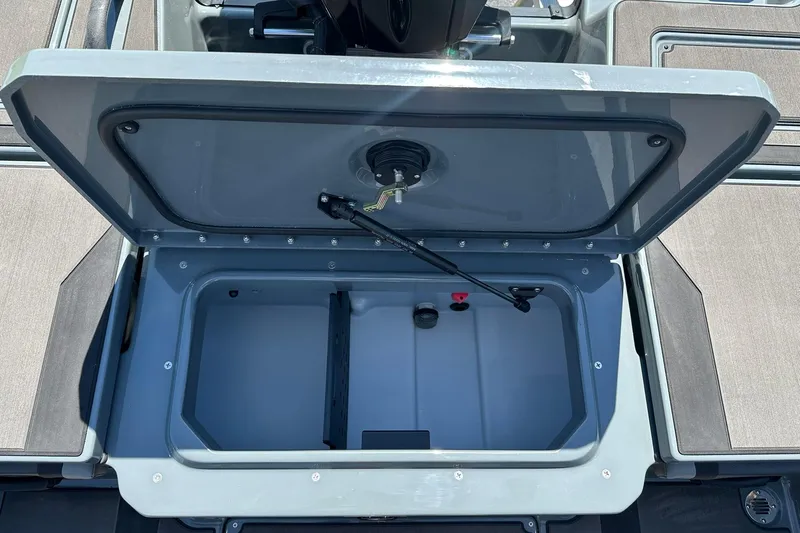 Slide: The Image of Open storage compartment on 2026 Lund 185 Impact GL boat. - 35