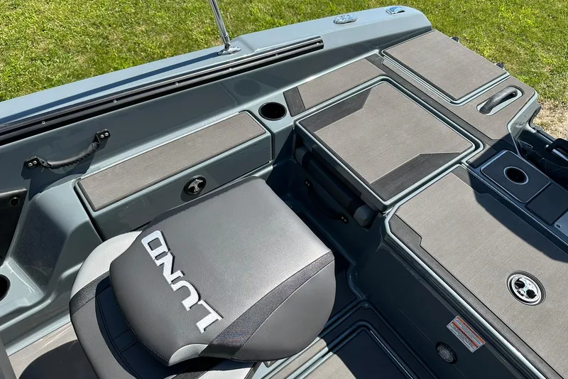 Slide: The Image of 2026 Lund 185 Impact GL boat interior with seating and storage compartments. - 36