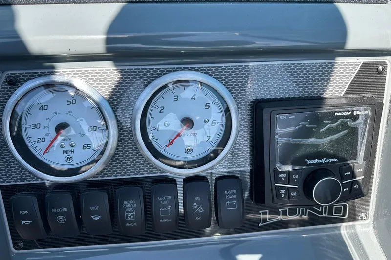 Slide: The Image of Dashboard of 2026 Lund 185 Impact GL boat with gauges and audio system. - 39