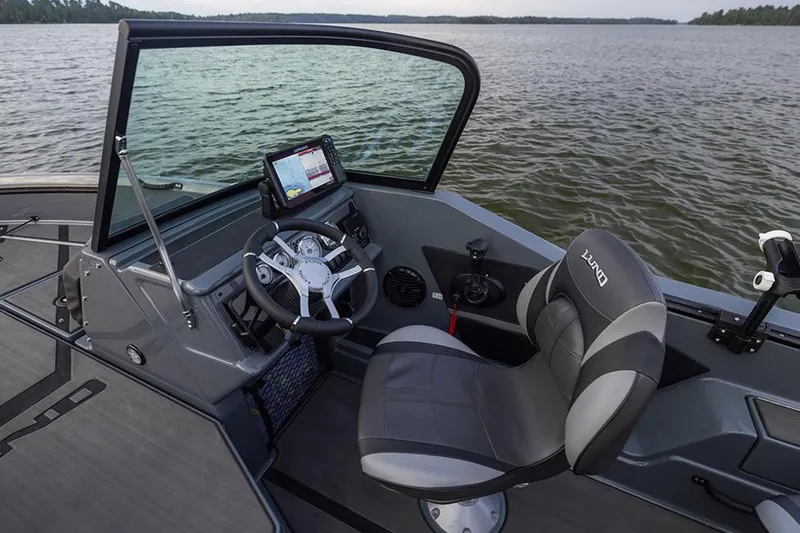 Slide: The Image of Manufacturer Provided Image: 2025 Lund 185 Impact GL boat interior with steering wheel and navigation system. - 48