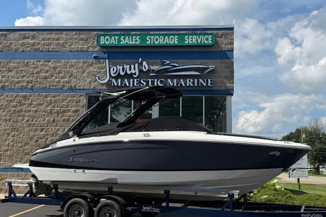 The Image of 2026 Regal LS4 boat on trailer at Jerry's Majestic Marine dealership. - 0
