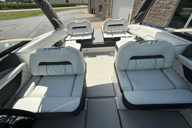 Slide: The Image of 2026 Regal LS4 boat interior with luxurious white seating and modern design. - 17