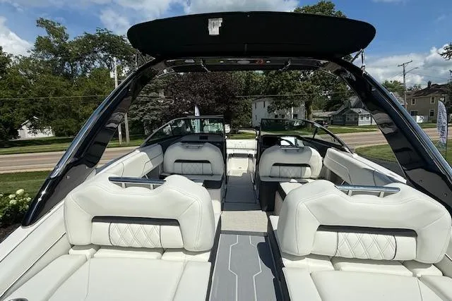 Slide: The Image of 2026 Regal LS4 boat interior with luxurious white seating and sleek design. - 2