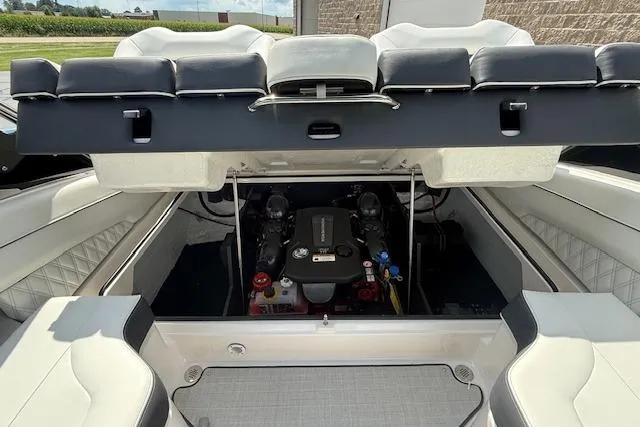 Slide: The Image of 2026 Regal LS4 boat engine compartment with open hatch, showcasing interior design and engine details. - 24