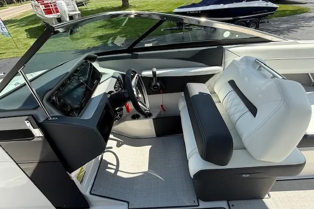 Slide: The Image of 2026 Regal LS4 boat interior with modern dashboard and white seating. - 4