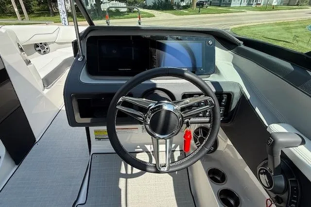 Slide: The Image of 2026 Regal LS4 boat dashboard with steering wheel and modern controls. - 5