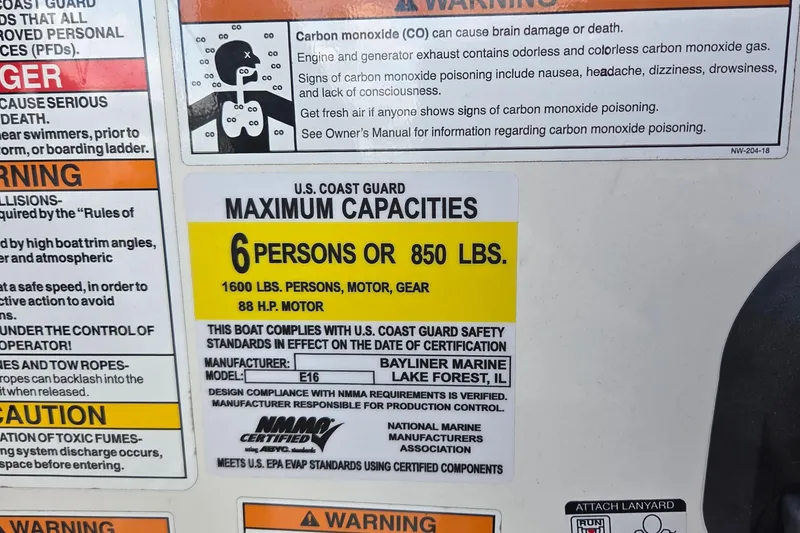 Slide: The Image of Warning label on 2020 Bayliner Element E16 boat, showing capacity and safety information. - 3
