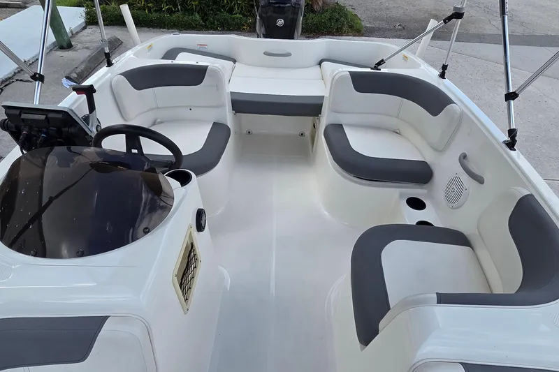Slide: The Image of 2020 Bayliner Element E16 boat interior with seating and steering console. - 5