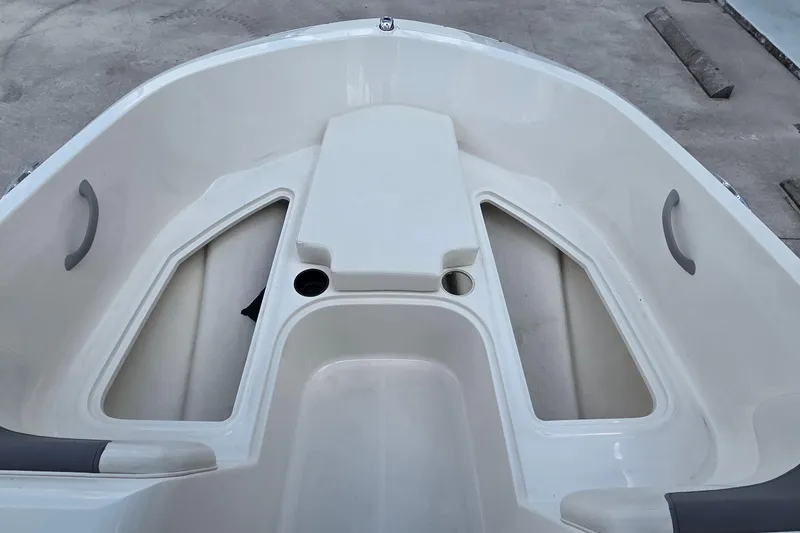 Slide: The Image of 2020 Bayliner Element E16 boat interior with seating and storage compartments. - 7