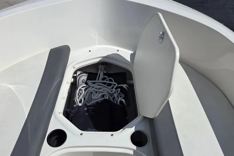 Slide: The Image of Open storage compartment on 2020 Bayliner Element E16 boat with ropes inside. - 8