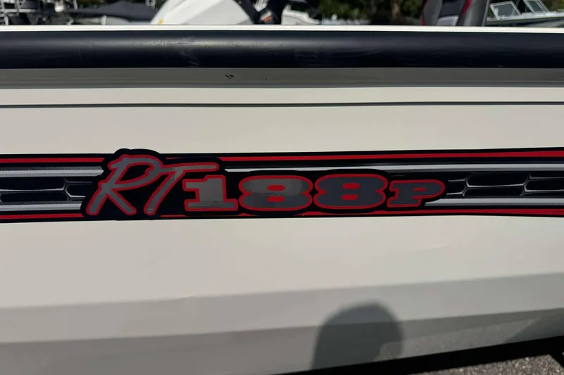 Slide: The Image of 2021 Ranger RT188P boat logo on white surface with red and black accents. - 3