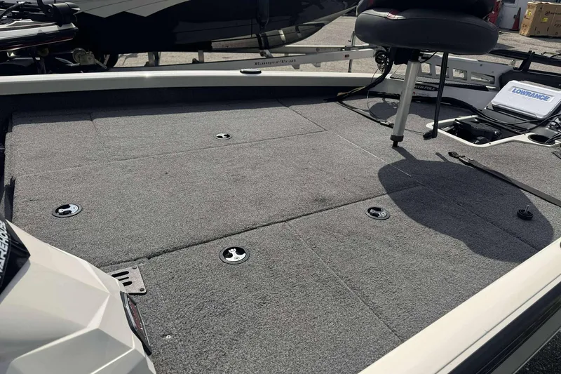Slide: The Image of 2021 Ranger RT188P boat deck with carpeted surface and fishing seat. - 6