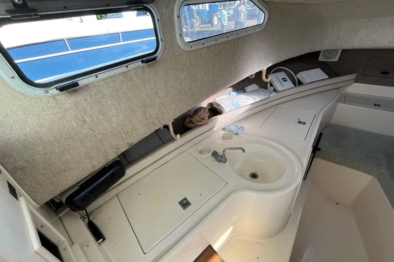 Slide: The Image of Interior cabin of 1999 Grady-White Gulfstream 232 boat with sink and storage. - 12