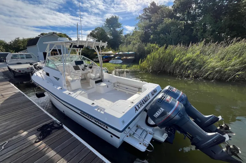 Slide: The Image of 1999 Grady-White Gulfstream 232 boat docked with twin Yamaha outboard engines. - 6