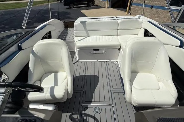 Slide: The Image of 2012 Regal 2000 Bowrider interior with white seating and gray flooring. - 16