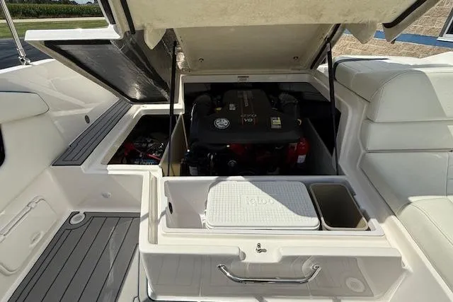 Slide: The Image of 2012 Regal 2000 Bowrider engine compartment with storage and seating area. - 18