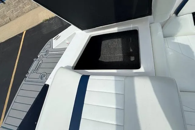 Slide: The Image of 2012 Regal 2000 Bowrider boat interior with open storage compartment. - 22