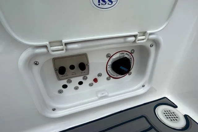 Slide: The Image of Control panel of a 2012 Regal 2000 Bowrider boat with switches and dials. - 23
