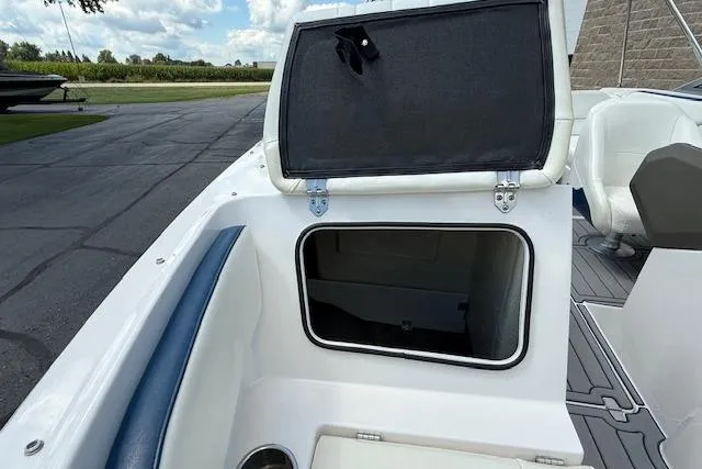 Slide: The Image of 2012 Regal 2000 Bowrider boat storage compartment open on deck. - 25