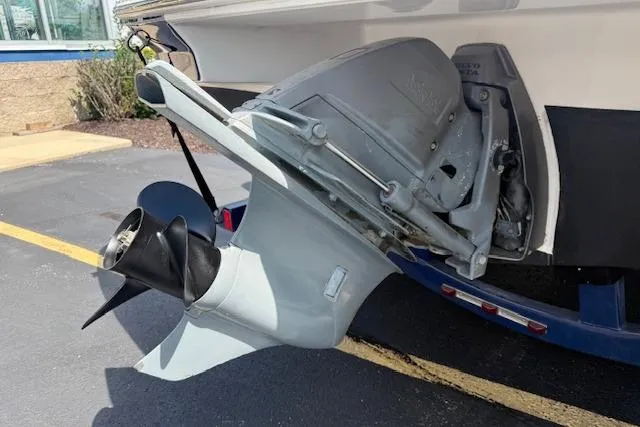 Slide: The Image of 2012 Regal 2000 Bowrider boat engine and propeller on trailer. - 27