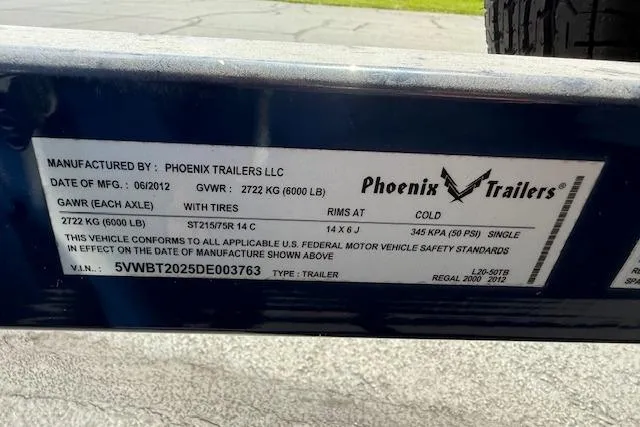 Slide: The Image of Label on Phoenix Trailers LLC, 2012 Regal 2000 Bowrider, showing specifications and compliance details. - 31