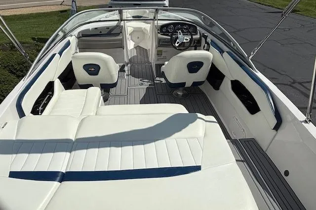 Slide: The Image of 2012 Regal 2000 Bowrider interior with white seating and modern dashboard. - 4