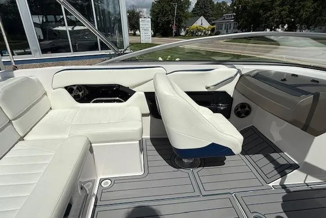 Slide: The Image of 2012 Regal 2000 Bowrider interior with white seating and modern dashboard design. - 5