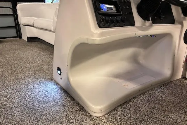 Slide: The Image of 2002 Aqua Patio AP 220 R boat interior with control panel and seating. - 16