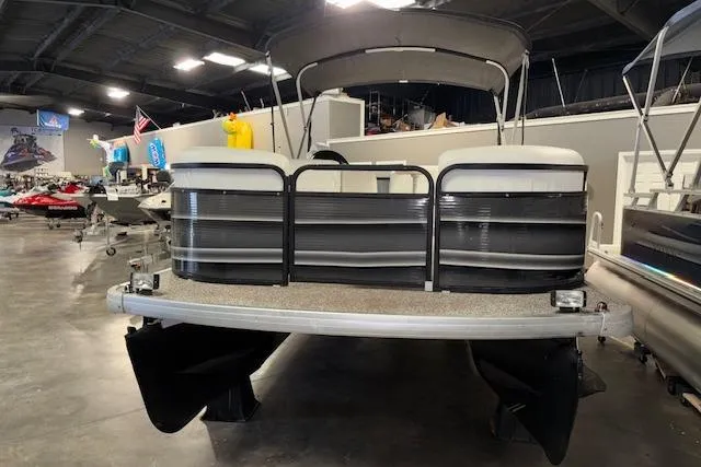 Slide: The Image of Aqua Patio AP 220 R 2002 pontoon boat displayed in indoor showroom. - 3