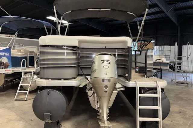 Slide: The Image of 2002 Aqua Patio AP 220 R pontoon boat with 75 HP outboard motor in storage. - 5