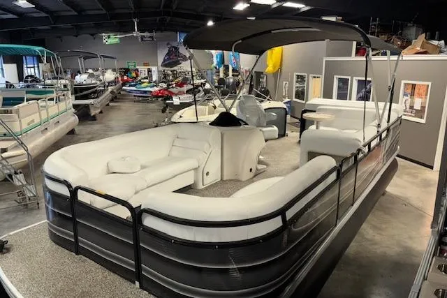 Slide: The Image of 2002 Aqua Patio AP 220 R pontoon boat in showroom with canopy and seating. - 7