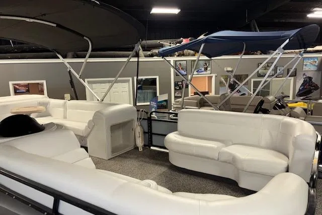 Slide: The Image of 2002 Aqua Patio AP 220 R pontoon boat with white seating and canopy in showroom. - 9