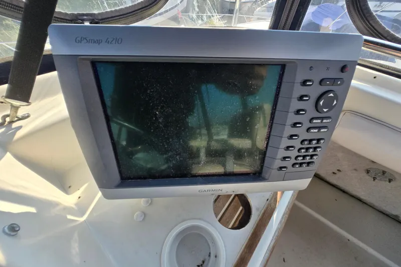 Slide: The Image of Garmin GPSmap 4210 on 1987 Silverton 34C boat dashboard. - 17