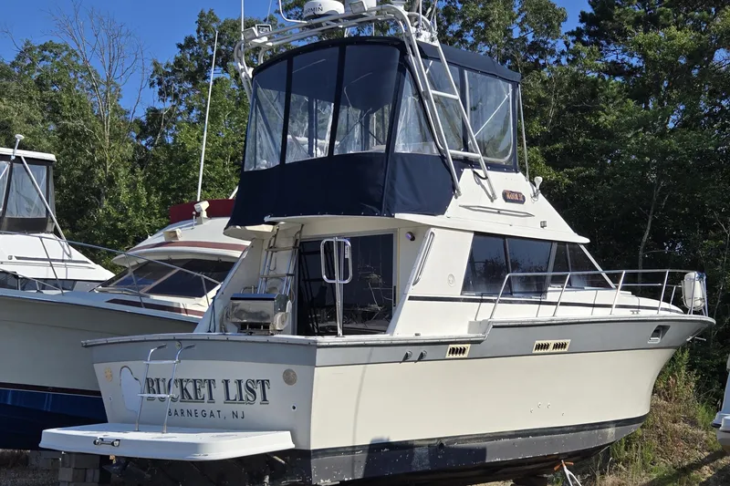 Slide: The Image of 1987 Silverton 34C boat named "Bucket List" docked in Barnegat, NJ. - 3